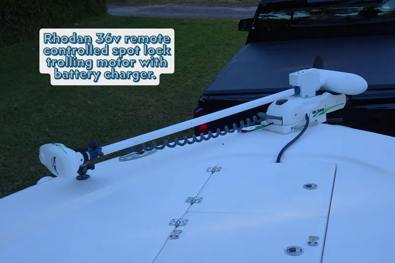 Slide: The Image of Robalo 246 Cayman 2022 with Rhodan 36v trolling motor and battery charger on deck. - 11