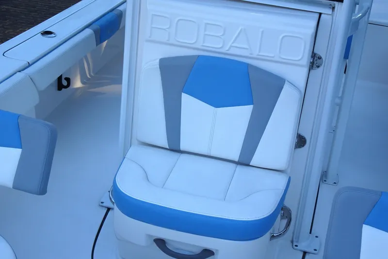 Slide: The Image of 2022 Robalo 246 Cayman boat seat with blue and white upholstery. - 14