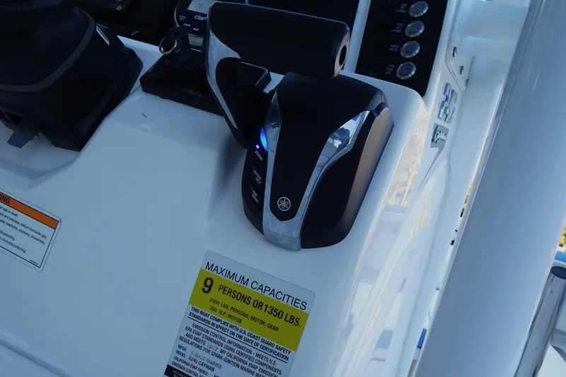 Slide: The Image of Control panel of 2022 Robalo 246 Cayman boat with capacity label. - 20