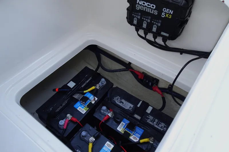 Slide: The Image of 2022 Robalo 246 Cayman boat battery compartment with NOCO Genius GEN5X3 charger. - 29