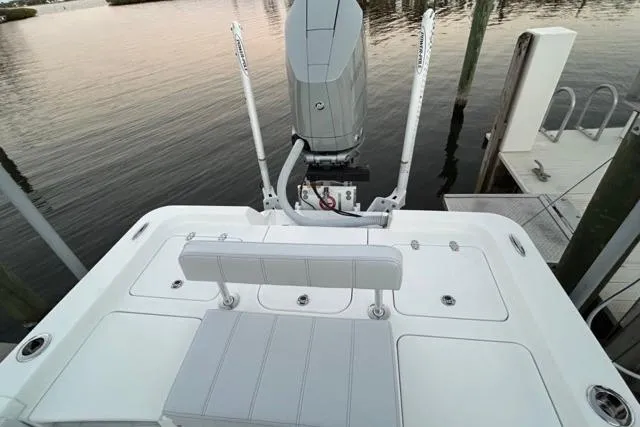 Slide: The Image of 2025 Contender 26 Bay boat stern view with motor and seating. - 13