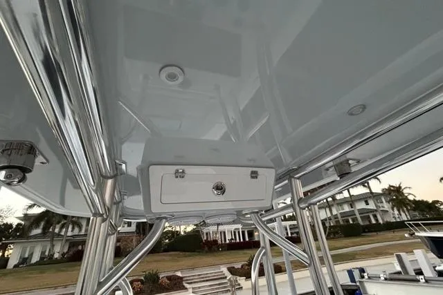 Slide: The Image of 2025 Contender 26 Bay boat with sleek T-top and storage compartment. - 15