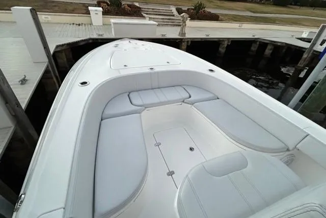 Slide: The Image of 2025 Contender 26 Bay boat with spacious seating at dock. - 16