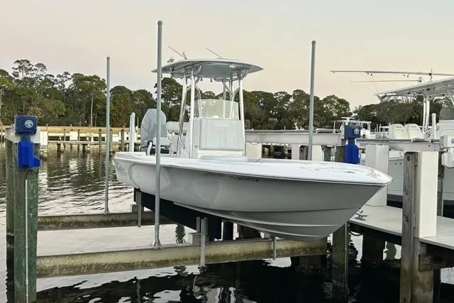 Slide: The Image of 2025 Contender 26 Bay boat docked at marina, showcasing sleek design and modern features. - 24