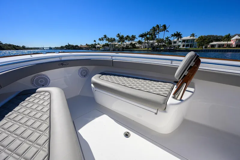 Slide: The Image of 2024 Valhalla Boatworks V-33 interior with luxurious seating and scenic waterfront view. - 15