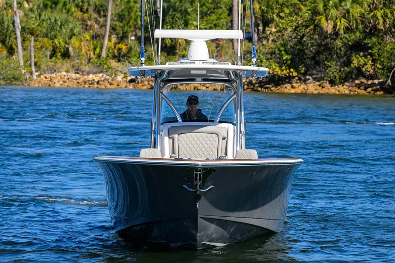 Slide: The Image of 2024 Valhalla Boatworks V-33 cruising on a scenic waterway. - 2