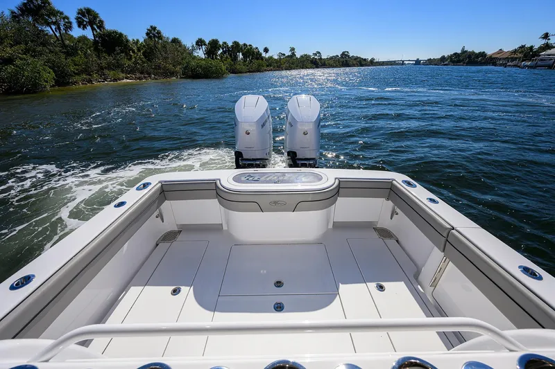 Slide: The Image of 2024 Valhalla Boatworks V-33 cruising on a sunny waterway with twin engines. - 24