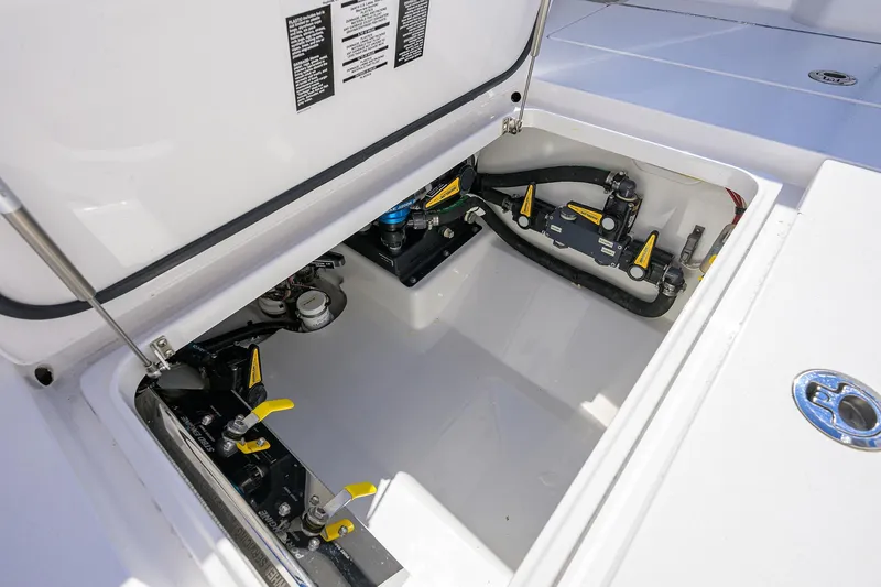 Slide: The Image of 2024 Valhalla Boatworks V-33 storage compartment with mechanical components and wiring. - 29