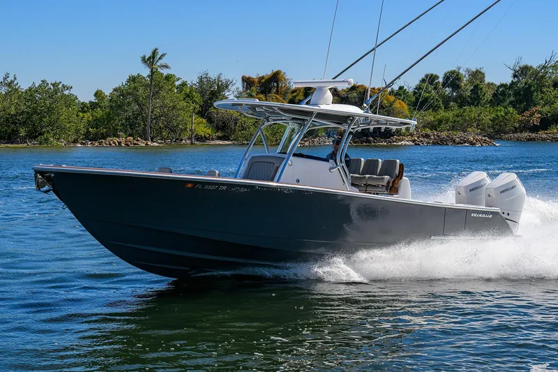 Slide: The Image of 2024 Valhalla Boatworks V-33 cruising on water, showcasing sleek design and powerful engines. - 3