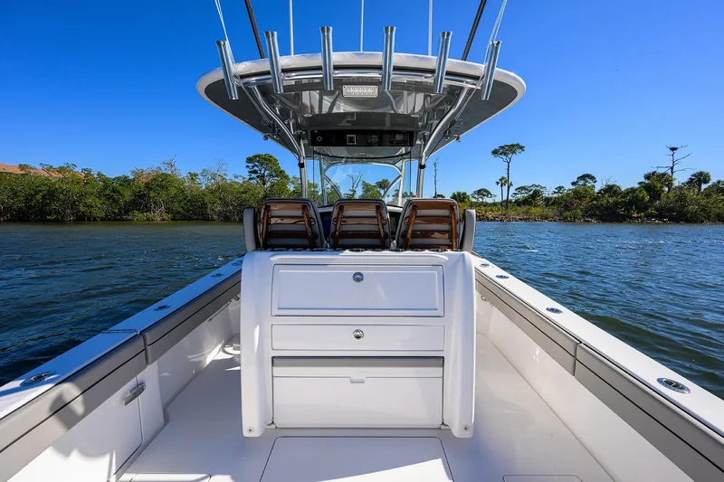 Slide: The Image of 2024 Valhalla Boatworks V-33 on water, showcasing sleek design and spacious deck. - 30
