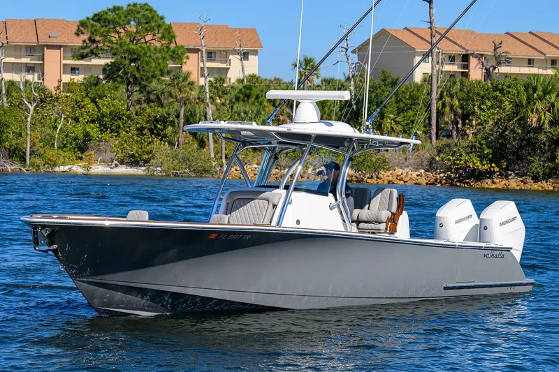 Slide: The Image of 2024 Valhalla Boatworks V-33 cruising on water with twin Mercury engines. - 5