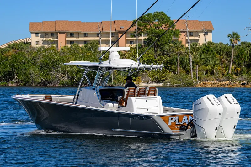 Slide: The Image of 2024 Valhalla Boatworks V-33 cruising on water with twin Mercury engines. - 6