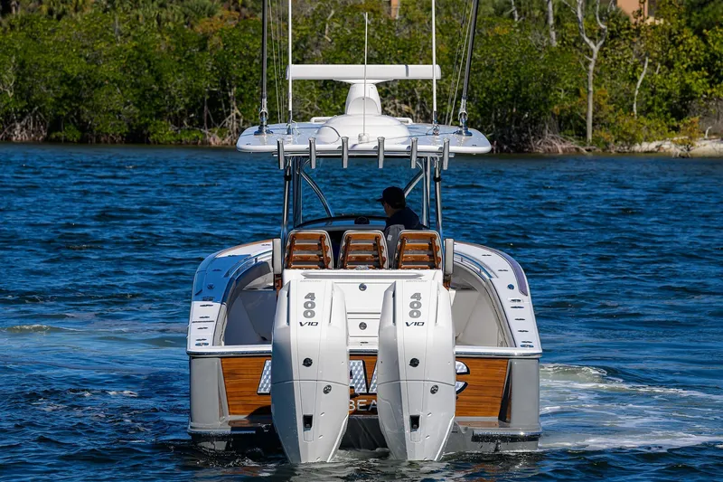 Slide: The Image of 2024 Valhalla Boatworks V-33 on water, featuring dual 400 V10 engines. - 7