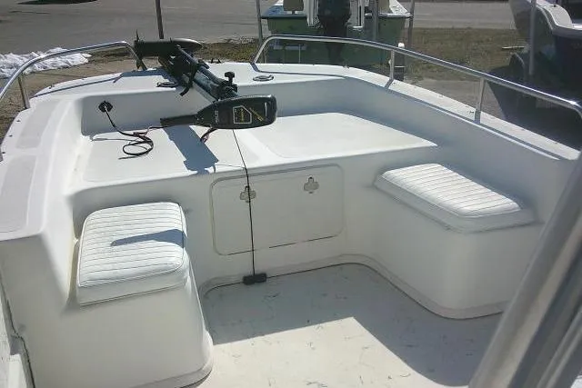 Slide: The Image of 2005 Sundance B22CX boat interior with seating and mounted equipment. - 12