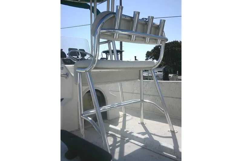 Slide: The Image of Aluminum boat seat on 2005 Sundance B22CX, featuring rod holders and sturdy design. - 25