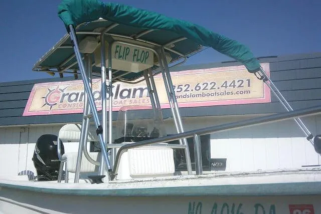 Slide: The Image of 2005 Sundance B22CX boat with canopy, parked at Grand Slam Boat Sales. - 4
