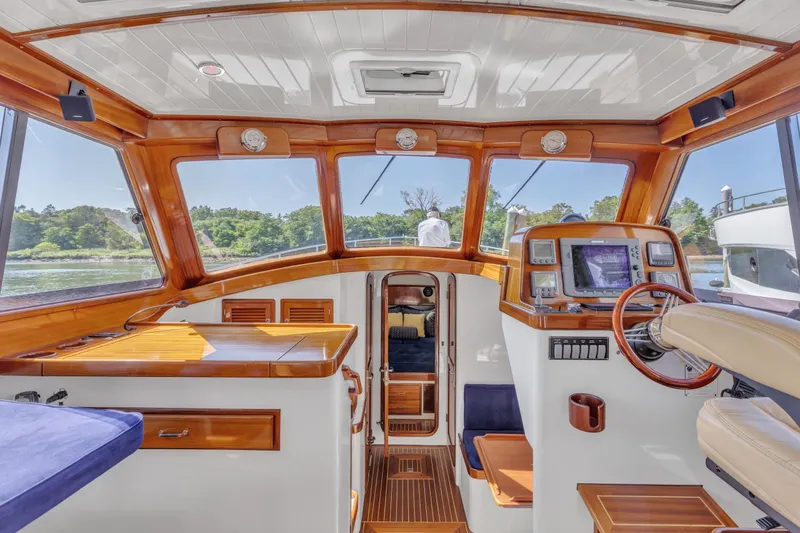 Slide: The Image of Interior of 2007 Gorbon Custom Downeast 40 yacht with wooden accents and navigation equipment. - 19