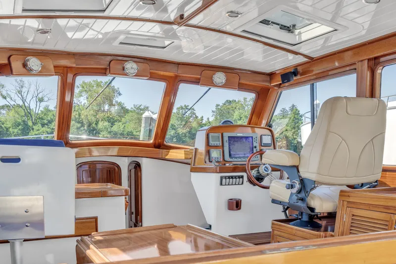 Slide: The Image of Luxurious 2007 Gorbon Custom Downeast 40 yacht interior with navigation equipment and captain's chair. - 20