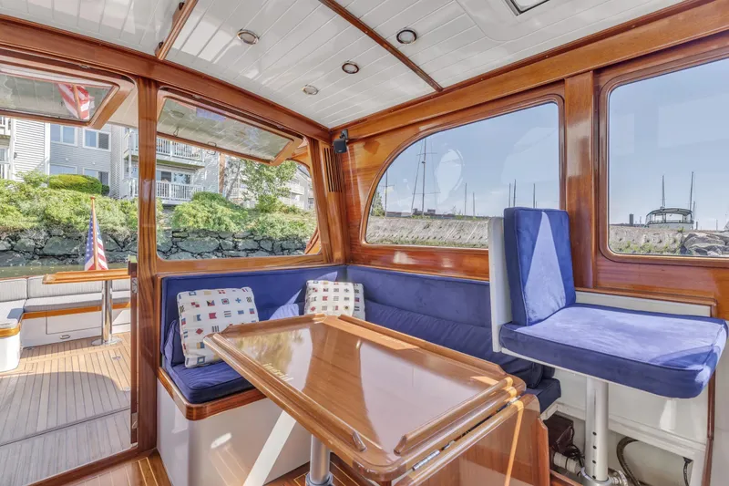 Slide: The Image of Luxurious 2007 Gorbon Custom Downeast 40 yacht interior with wooden finish and blue seating. - 23