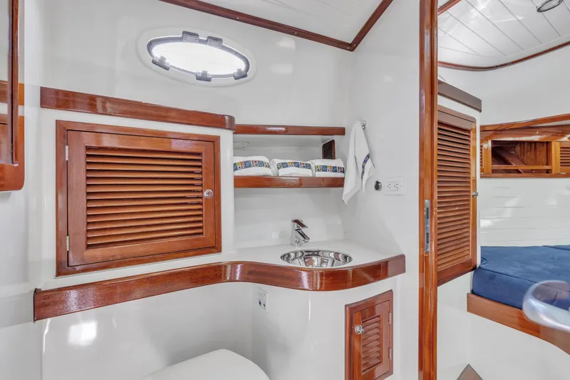 Slide: The Image of Luxurious 2007 Gorbon Custom Downeast 40 yacht interior with wooden cabinetry and modern amenities. - 29
