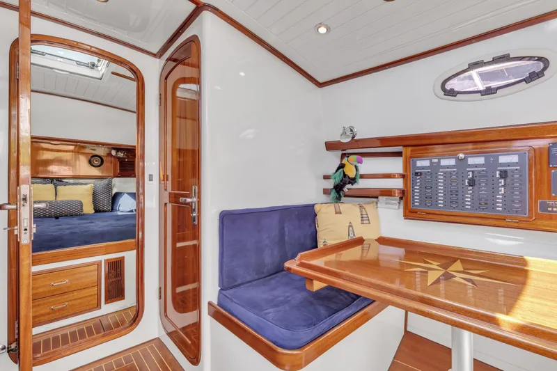 Slide: The Image of Interior of 2007 Gorbon Custom Downeast 40 yacht with wood accents and blue seating. - 31
