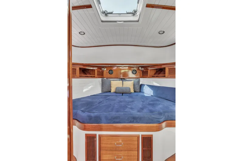 Slide: The Image of Luxurious cabin interior of 2007 Gorbon Custom Downeast 40 yacht with blue bedding. - 34