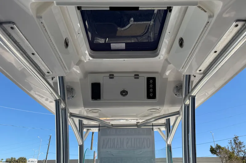 Slide: The Image of 2021 Sea Fox 248 Commander boat interior, featuring overhead console and hatch. - 16
