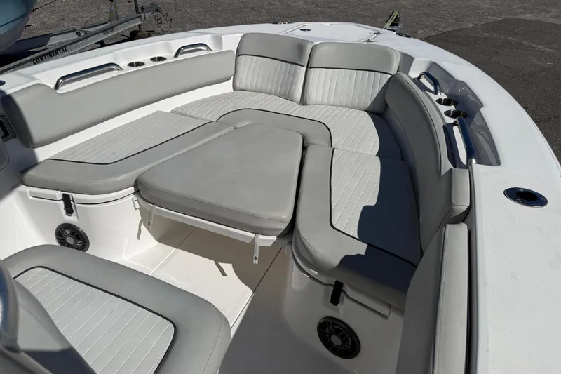 Slide: The Image of 2021 Sea Fox 248 Commander boat interior with gray cushioned seating and cup holders. - 7