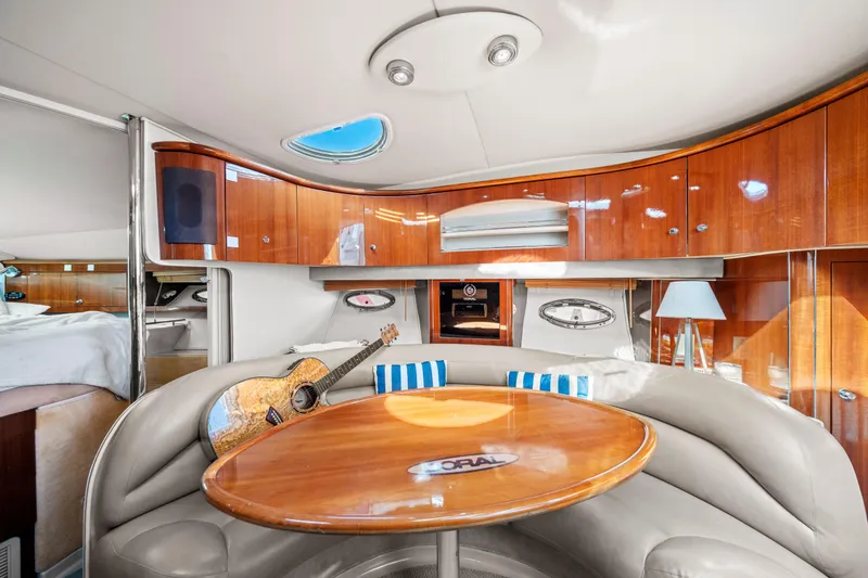 Slide: The Image of Luxurious interior of 2005 Doral 360se yacht with wooden cabinetry and cozy seating area. - 13