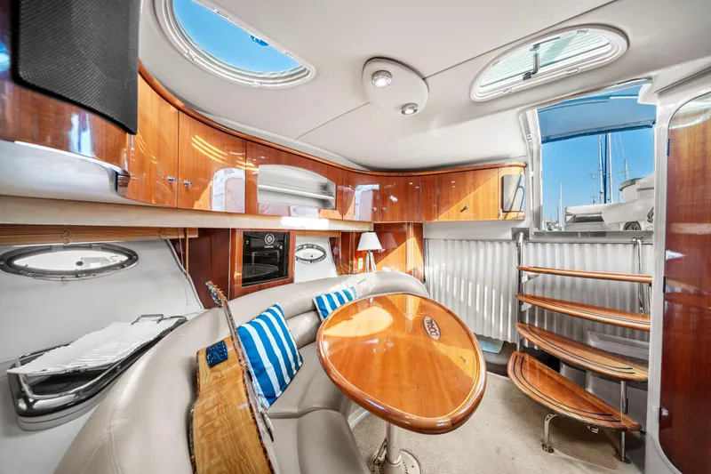 Slide: The Image of Luxurious interior of a 2005 Doral 360se yacht with elegant wood finishes and seating area. - 14