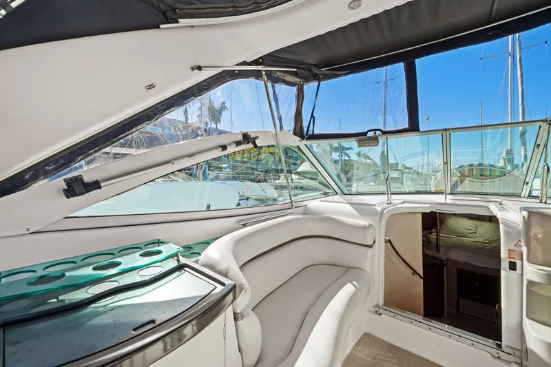 Slide: The Image of Interior of 2005 Doral 360se yacht with white seating and cabin entrance. - 20