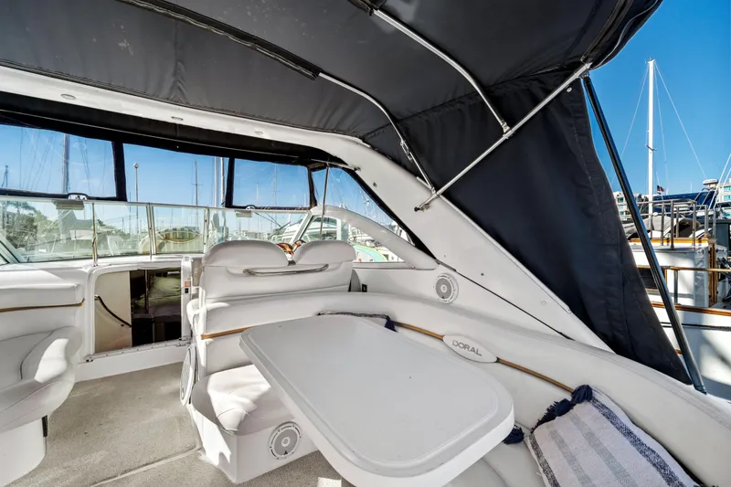 Slide: The Image of 2005 Doral 360se yacht interior with seating and table, docked at marina. - 26