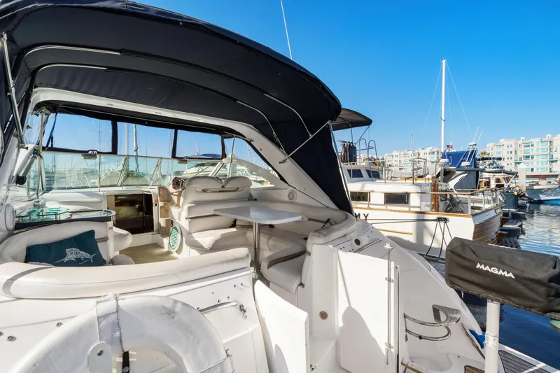 Slide: The Image of 2005 Doral 360se yacht interior with seating, table, and marina view. - 29