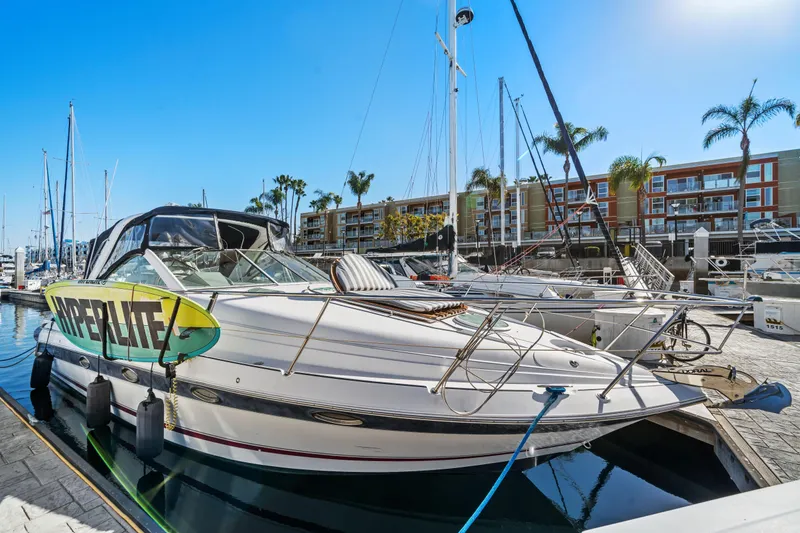 Slide: The Image of 2005 Doral 360se boat docked at marina with wakeboard, palm trees, and clear sky. - 7