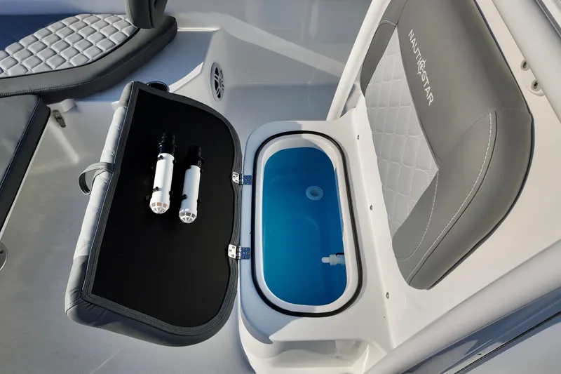 Slide: The Image of 2026 NauticStar 231 Hybrid boat interior with seating and storage compartment. - 13
