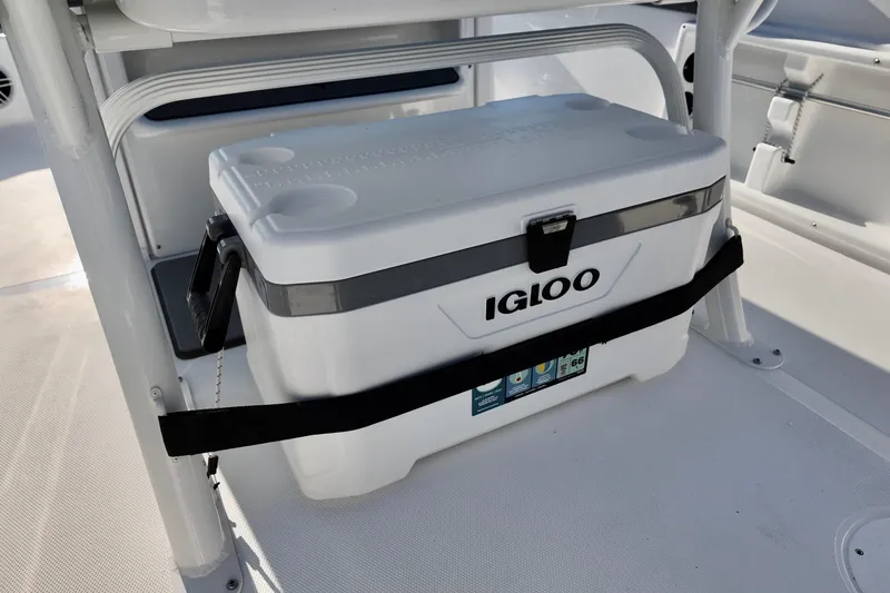 Slide: The Image of Igloo cooler secured on 2026 NauticStar 231 Hybrid boat deck. - 9