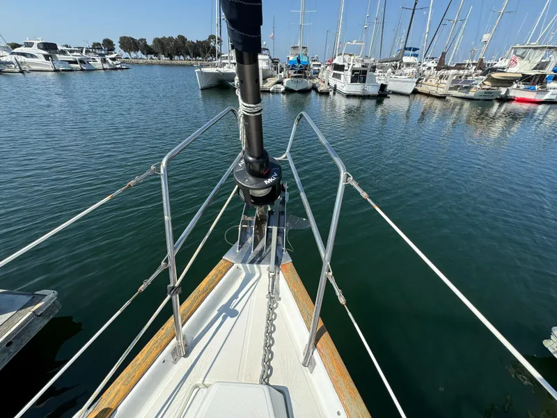 Slide: The Image of Bow view of 2001 Beneteau Oceanis Clipper 473 docked in a marina. - 11