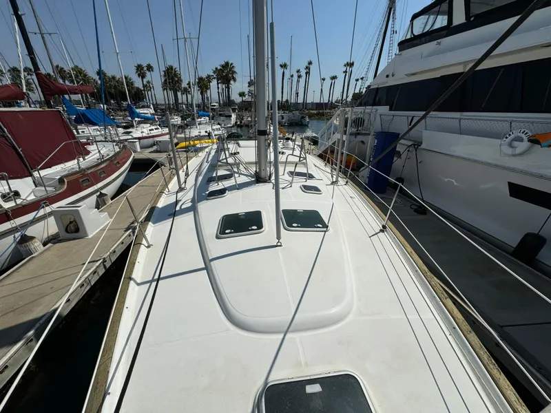 Slide: The Image of Beneteau Oceanis Clipper 473 sailboat deck, docked in a marina, 2001 model. - 12