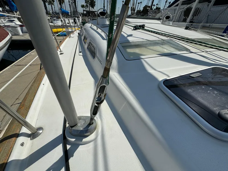 Slide: The Image of Beneteau Oceanis Clipper 473 sailboat deck, 2001 model, docked at marina. - 13