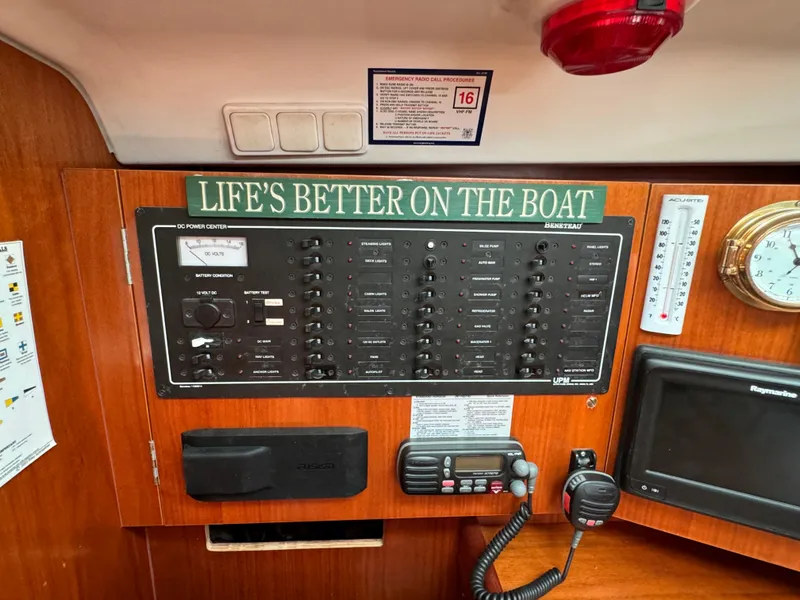 Slide: The Image of Control panel of a 2001 Beneteau Oceanis Clipper 473 with nautical instruments and signage. - 17