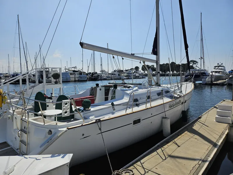 Slide: The Image of Beneteau Oceanis Clipper 473 sailboat docked at marina, 2001 model. - 2
