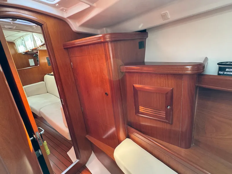 Slide: The Image of Interior of 2001 Beneteau Oceanis Clipper 473 yacht with wooden cabinetry and seating. - 22