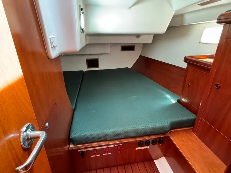 Slide: The Image of Cozy cabin interior of 2001 Beneteau Oceanis Clipper 473 sailboat with wooden finish. - 25