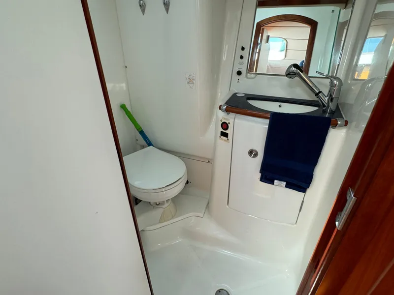 Slide: The Image of Bathroom of 2001 Beneteau Oceanis Clipper 473 yacht, featuring toilet and sink. - 26