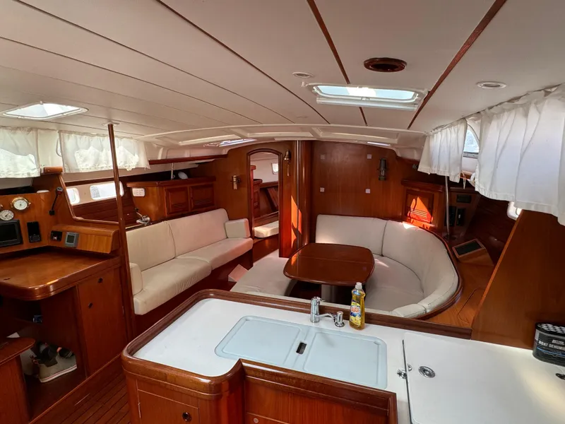 Slide: The Image of Spacious interior of 2001 Beneteau Oceanis Clipper 473 yacht with elegant wood finish. - 29