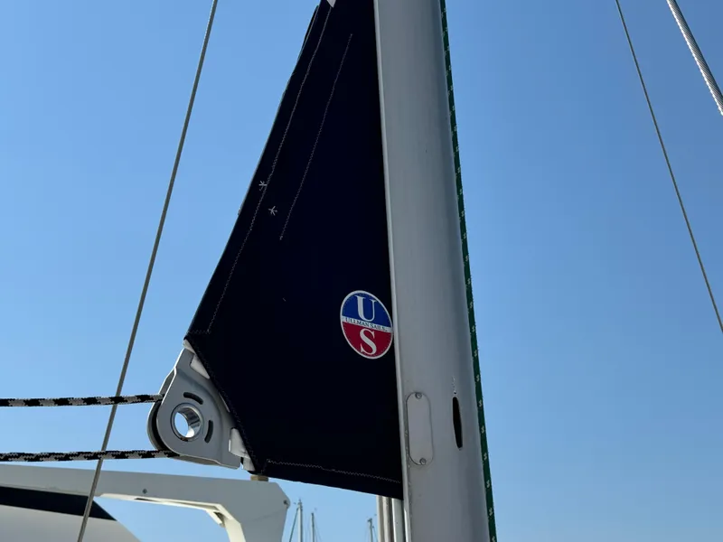 Slide: The Image of Sail of 2001 Beneteau Oceanis Clipper 473 against clear blue sky. - 8