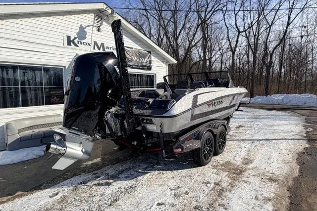Slide: The Image of 2026 Vexus VXs20 boat parked outside Knox Marine dealership in snowy setting. - 7