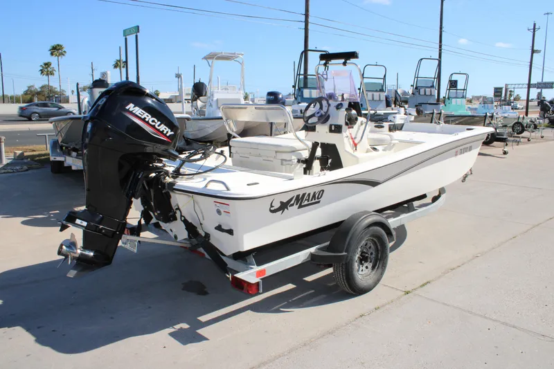 Slide: The Image of 2022 Mako Pro Skiff 15 CC boat with Mercury engine on trailer. - 11