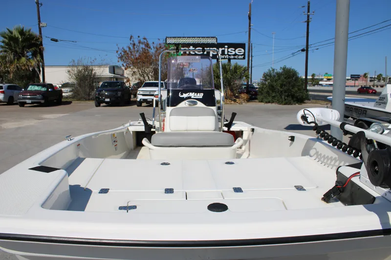Slide: The Image of 2022 Mako Pro Skiff 15 CC boat, white interior, parked outdoors on a sunny day. - 7