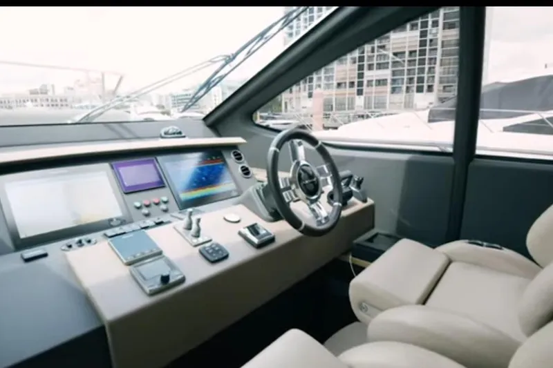 Slide: The Image of Cockpit of 2017 Azimut 66 yacht with modern navigation equipment and luxurious seating. - 13